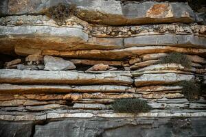 Compressed stone layers on a montain in Rhodes, Greece photo