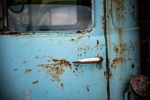 Classic, vintage truck, rat rod, with paint pealing off at the garage photo