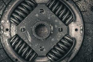 Old clutch durring replacement in a garage close up photo
