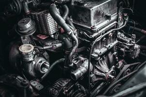 Modern japanese diesel engine being stripped down in a garage waiting for repair. photo