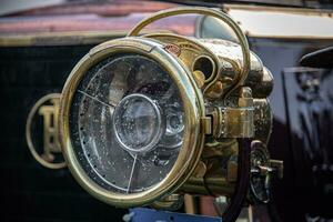 Gas headlight of vintage, veteran car on a classic car show in Brighton, East Sussex, UK photo