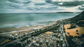 Aerial view of a little town surrounded by beautiful nature Llanfairfechan, North Wales, Cymru, UK photo