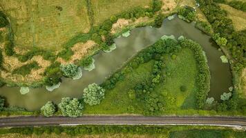 Aerial view of river and a close by railway on a sunny summer day, Peacehaver, East Sussex, UK photo