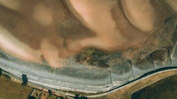 Aerial view of low tide with visible river bed by the beach Llanfairfechan, North Wales, Cymru, UK photo