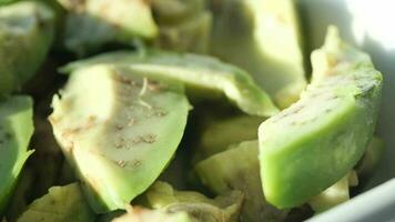 slice of avocado on wooden table video