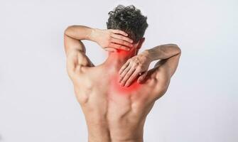 Neck and back pain concept, man with neck and back muscle pain, Close up of man with neck and back pain, a man with muscle pain on isolated background. photo