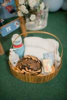 a basket with a towel, toothbrush, and other items photo