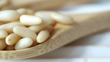 Healthy pine nuts isolated on white background. video