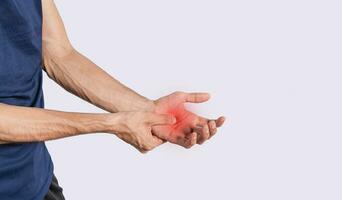 Person with palm pain, concept of a man with pain in the hands, man with arthritis rubbing, person with pain in the hands photo