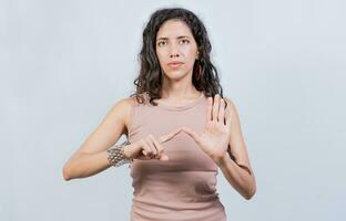 Lating girl gesturing in sign language isolated. Young woman gesturing in sign language, People speaking in sign language isolated photo