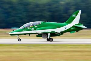 Military trainer plane at air base. Air force flight training. Aviation and aircraft. Aerobatic. Military industry. Fly and flying. photo