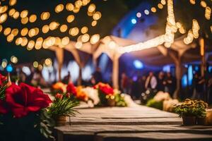 un mesa con flores y luces a noche. generado por ai foto