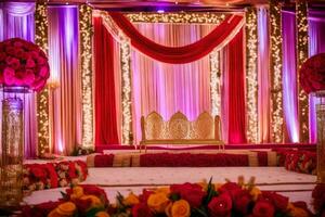 an indian wedding stage decorated with red and gold flowers. AI-Generated photo