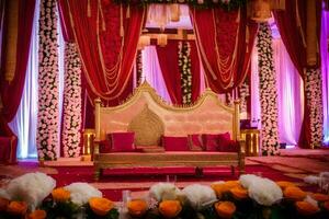 an indian wedding stage decorated with red and gold. AI-Generated photo