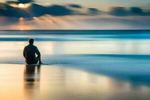 un hombre sentado en el playa a puesta de sol. generado por ai foto