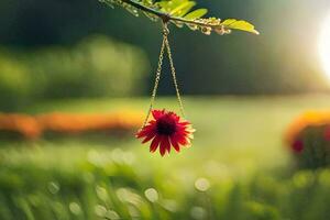 a red flower hangs from a chain in a field. AI-Generated photo