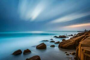 a long exposure photograph of the ocean and rocks. AI-Generated photo