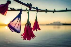 red flowers hanging from a wire over the water. AI-Generated photo