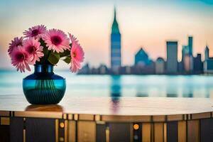un florero con rosado flores en un mesa en frente de un ciudad horizonte. generado por ai foto