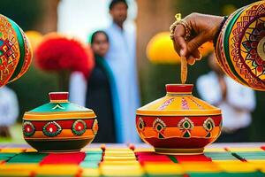 a person is pouring a pot of colored paint on a table. AI-Generated photo