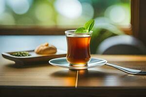 a cup of tea with mint leaves on the table. AI-Generated photo