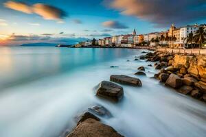 the sunset over the sea and rocks in the foreground. AI-Generated photo