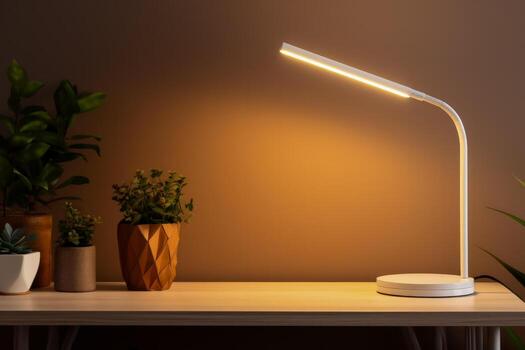 Minimalist LED table lamp on a plain desk background with empty space for text photo