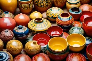 many colorful pottery vases are displayed on a table. AI-Generated photo