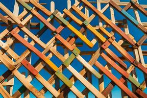 a colorful wall made of wooden sticks. AI-Generated photo