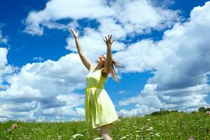 Happy girl in yellow dress photo