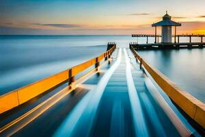 un largo exposición fotografía de un muelle a puesta de sol. generado por ai foto