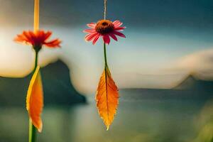 two flowers hanging from a string with leaves in the background. AI-Generated photo