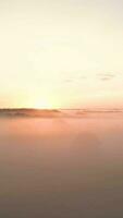 a sunrise over a foggy landscape video