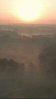 a sunrise over a foggy landscape video