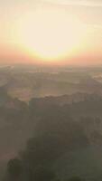 a sunrise over a foggy landscape video