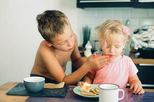 Little girl is taken care of. Brother always looking after her photo