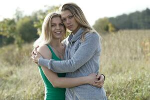 Two loving sisters comforting each other photo