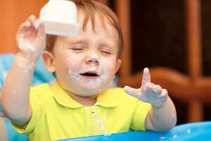 Little boy crying with face got dirty photo