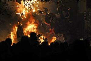 Sculpture Fallas burning in fire photo