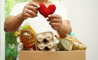 Asian woman holding human internal organ model, donation charity volunteer concept. photo