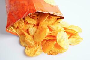 Potato chips in open bag, delicious BBQ seasoning spicy for crips, thin slice deep fried snack fast food. photo