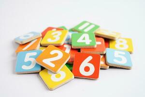 Number wood block cubes for learning Mathematic, education math concept. photo