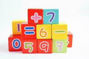 Number wood block cubes for learning Mathematic, education math concept. photo