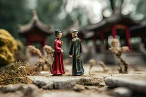 Chinese wedding in miniature style. Husband and wife in traditional Chinese clothes. Concept of love, tradition, family and relationships. Asian man and woman created with Generative AI Technology photo