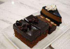 Mini cakes with chocolate and cheesecake photo