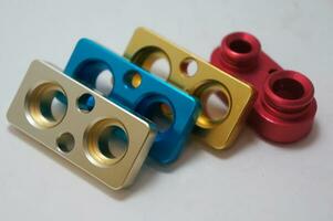 a batch of anodize aluminum cnc parts production. close-up. photo
