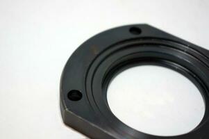 Black steel face flange part manufacturing with CNC machine. photo