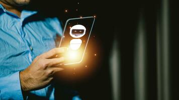 Smartphone in the hands of a man against the background of the window photo