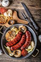 Roasted sausages with vegetable and draft beer. photo