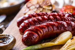 Roasted sausages with vegetable and draft beer. photo